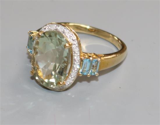 A modern 9ct gold gem and diamond set dress ring, size P.